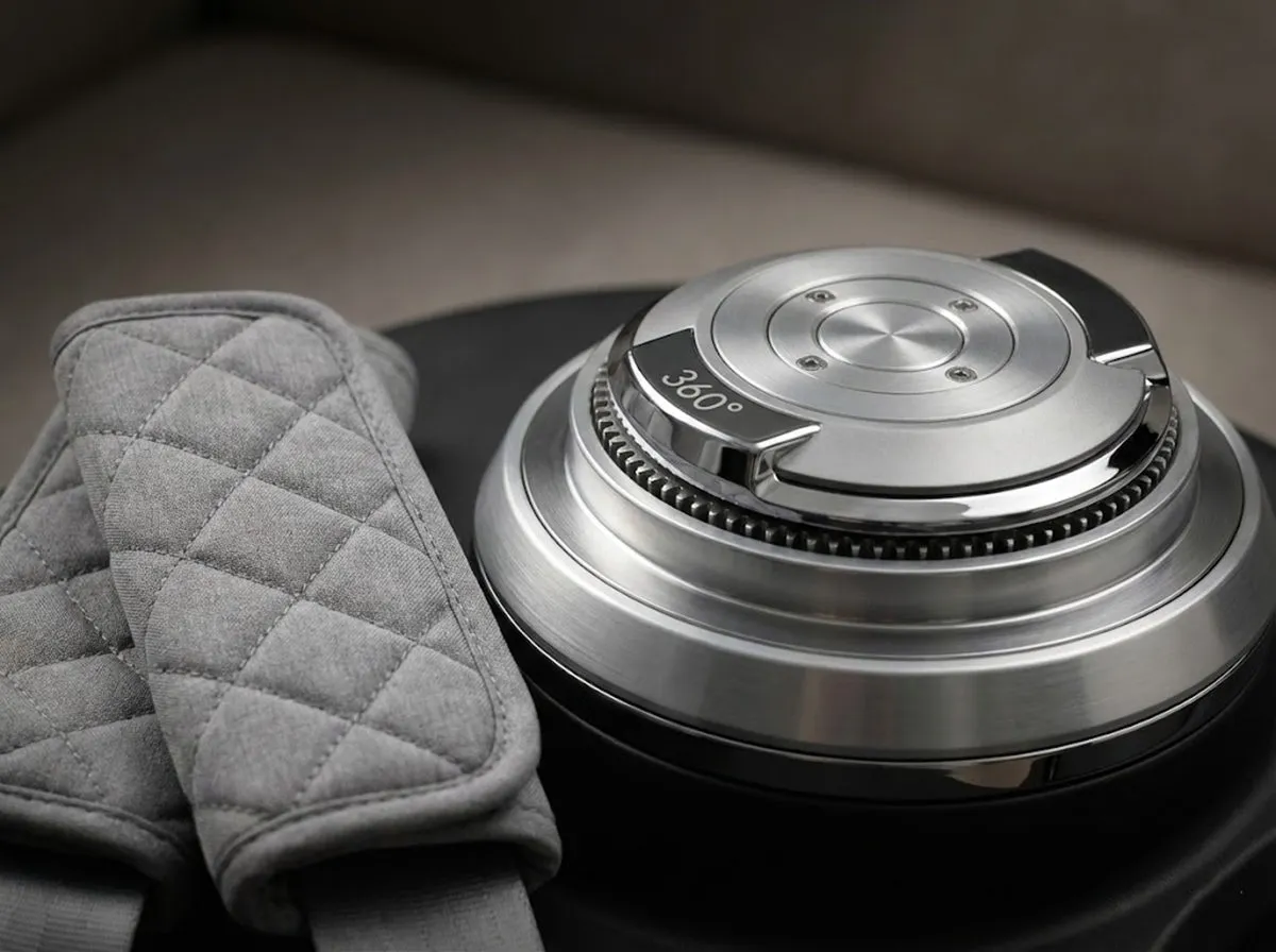 Innovation fueling stroller market expansion showing close-up of 360-degree rotation mechanism and premium quilted seat belt pads.