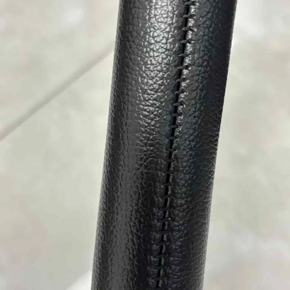 Auto-fold stroller trends: Close-up of premium hand-stitched eco-leather handle on the ST523 auto-fold stroller.