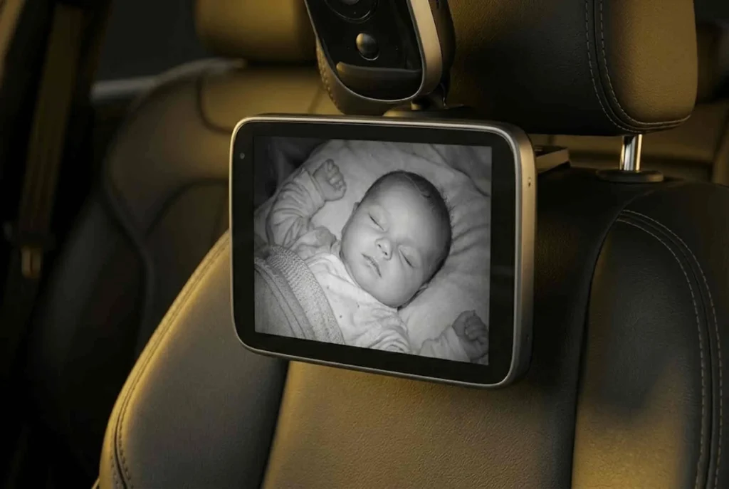 Counterfeit car seats safety tech: A 2K HD night vision back-seat camera mounted on a car headrest for secure baby monitoring.
