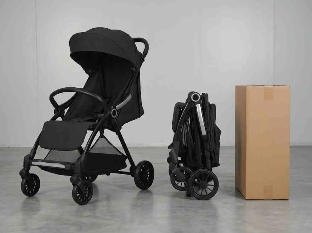 Cobblestone Stroller Wholesale: ST523 stroller shown unfolded and compactly folded next to a standard export carton.