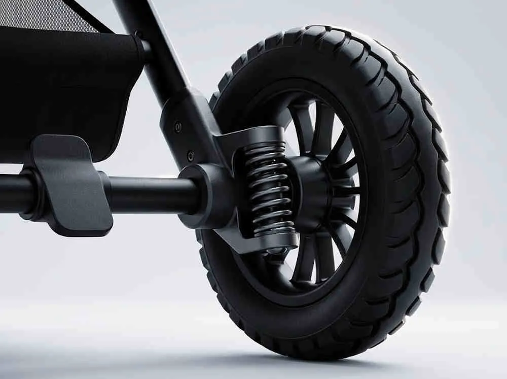 Cobblestone Stroller Wholesale: Close-up of the ST523 8-inch PU rear wheel and industrial spring suspension system.