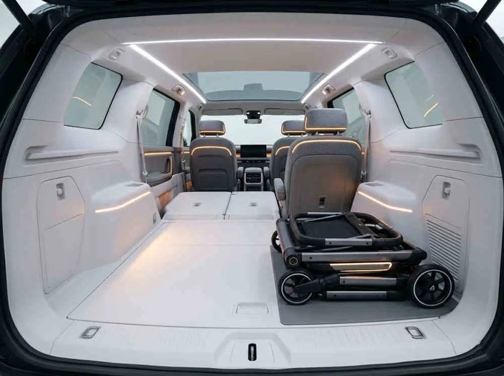 Showroom-ready auto-fold stroller wholesale: Compact stroller folded flat inside a futuristic white electric vehicle.